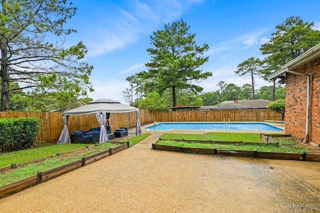 view of yard featuring a gazebo, a fenced in pool, a patio, and a fenced backyard