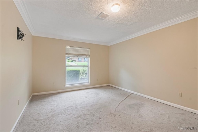 spare room with crown molding, carpet, and baseboards