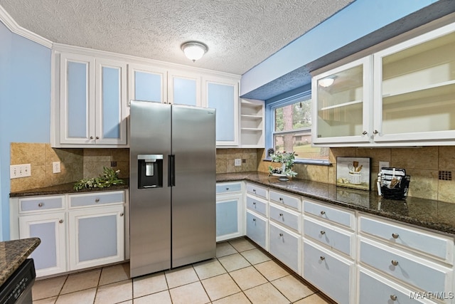 kitchen featuring tasteful backsplash, appliances with stainless steel finishes, and white cabinets