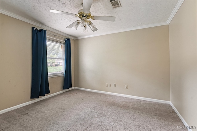 carpeted spare room with ornamental molding, a textured ceiling, and ceiling fan