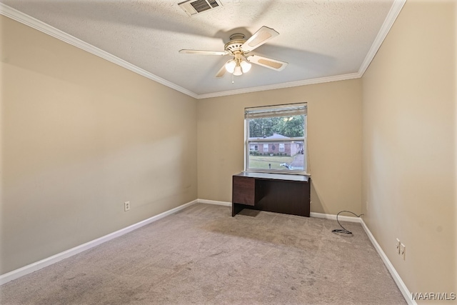 carpeted spare room with crown molding, a textured ceiling, and ceiling fan