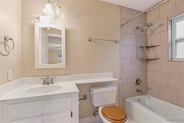 bathroom with washtub / shower combination, toilet, and vanity