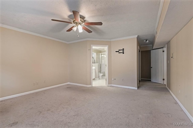 carpeted empty room with baseboards, a textured ceiling, ceiling fan, and crown molding