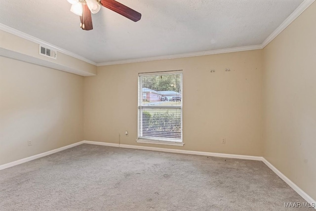 carpeted spare room with visible vents, ornamental molding, a ceiling fan, a textured ceiling, and baseboards