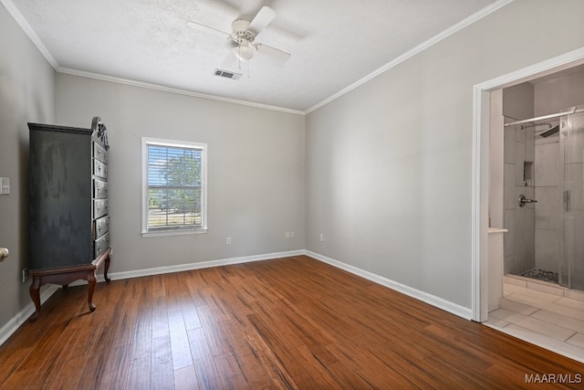 unfurnished bedroom with crown molding, ceiling fan, hardwood / wood-style floors, and a closet