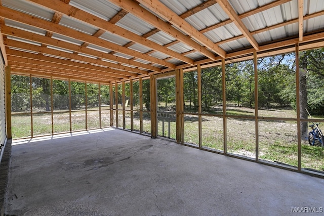 unfurnished sunroom featuring plenty of natural light