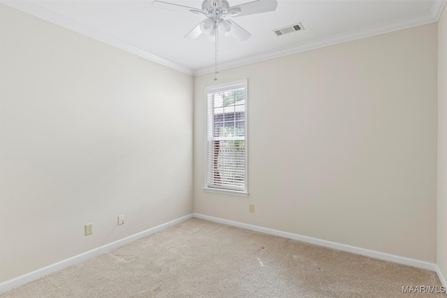 carpeted empty room with ceiling fan and crown molding