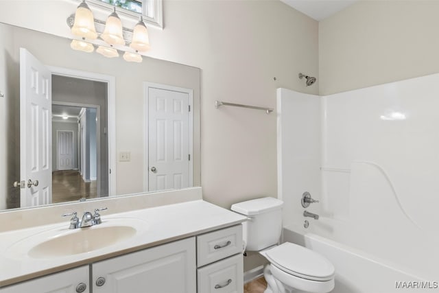 full bathroom with vanity, bathing tub / shower combination, and toilet