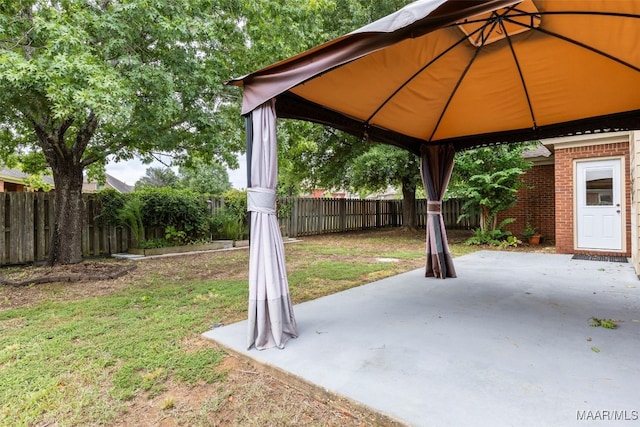 view of yard featuring a gazebo and a patio area