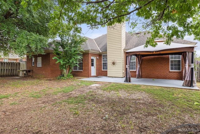 rear view of property with a patio area