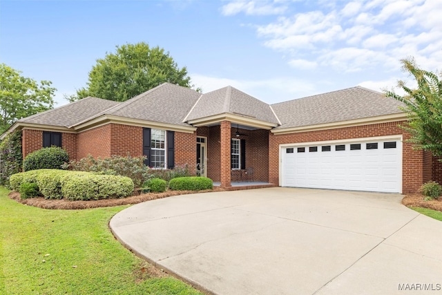 ranch-style home with a front yard and a garage