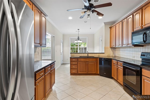 kitchen featuring ceiling fan, pendant lighting, sink, black appliances, and crown molding