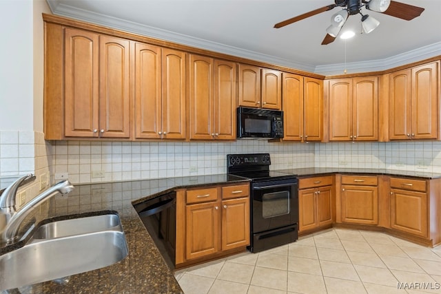 kitchen with ceiling fan, ornamental molding, sink, black appliances, and dark stone counters