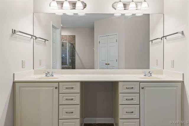 bathroom featuring walk in shower and vanity