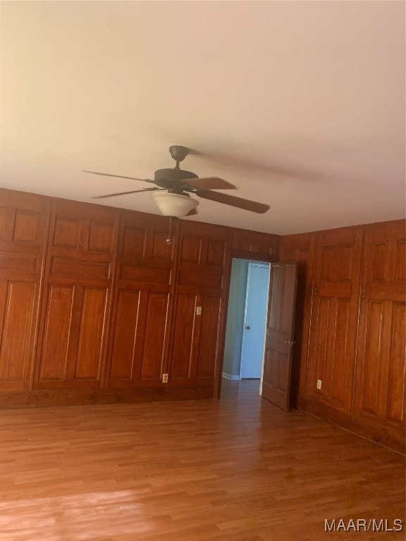 interior space featuring light hardwood / wood-style floors and ceiling fan