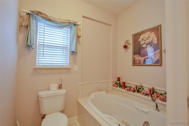 bathroom featuring toilet and a bathtub