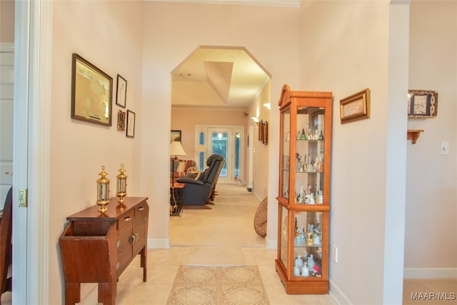 hall with light tile patterned floors