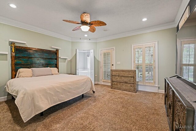 carpeted bedroom featuring ornamental molding and ceiling fan