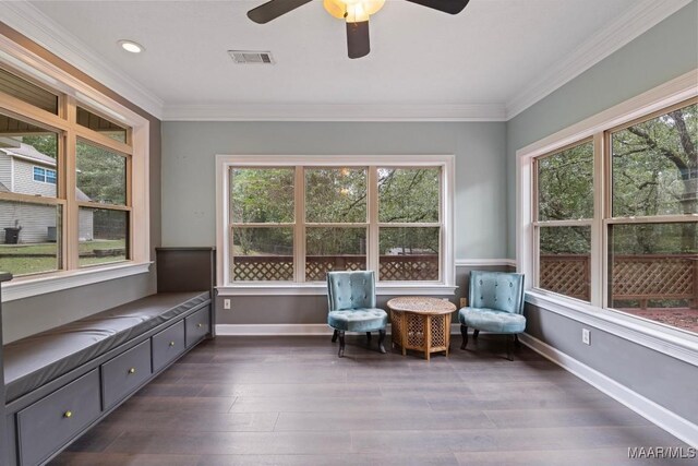 unfurnished room featuring ceiling fan, ornamental molding, and dark wood-type flooring