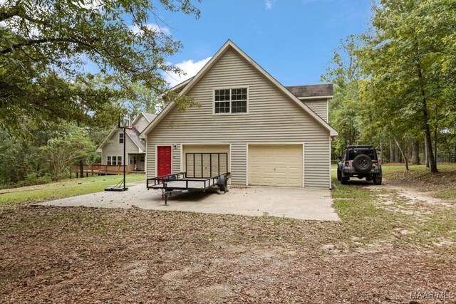 back of property featuring a garage