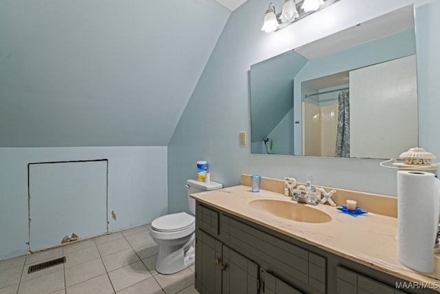 bathroom featuring toilet, lofted ceiling, tile patterned floors, vanity, and curtained shower