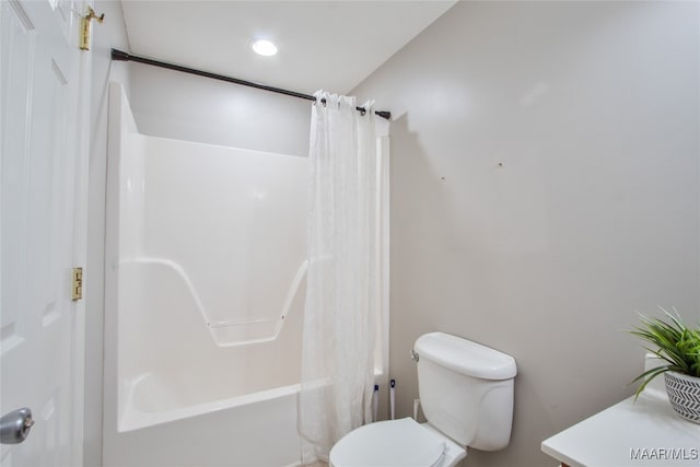 full bathroom with vanity, toilet, and shower / tub combo with curtain