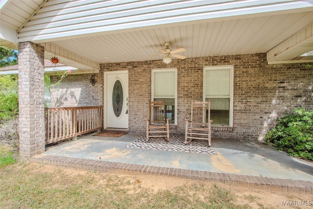 property entrance with a patio and ceiling fan