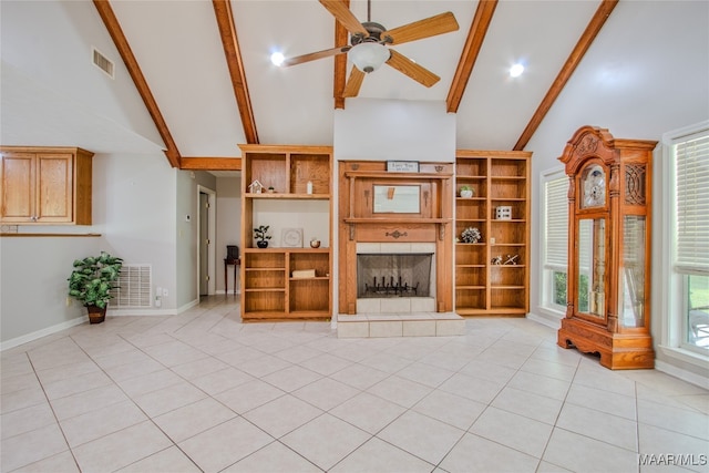 unfurnished living room featuring beamed ceiling, high vaulted ceiling, light tile patterned floors, and ceiling fan