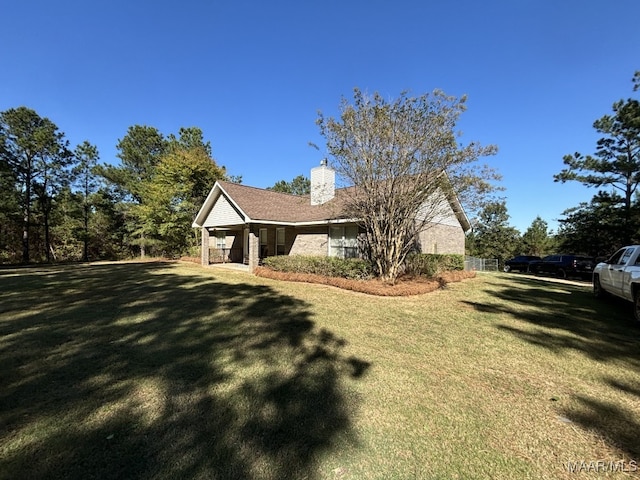 view of side of property featuring a lawn