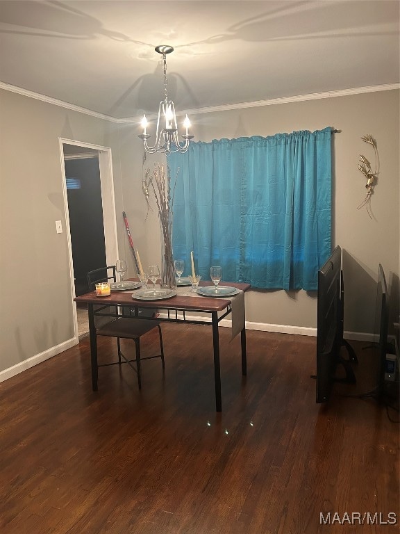 dining area with an inviting chandelier, crown molding, and dark hardwood / wood-style flooring