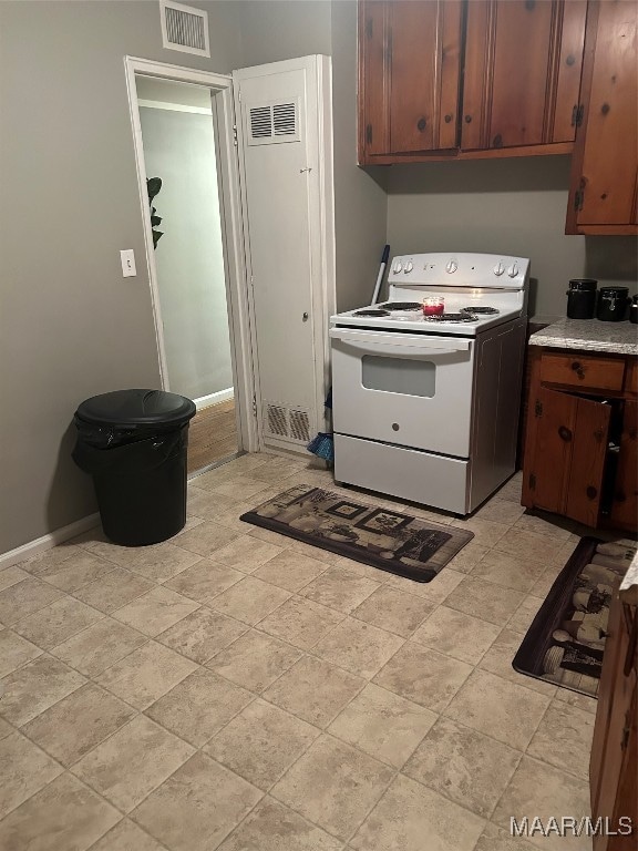 kitchen featuring white electric stove