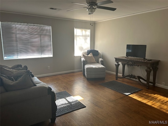 living room with ceiling fan, dark hardwood / wood-style floors, and crown molding