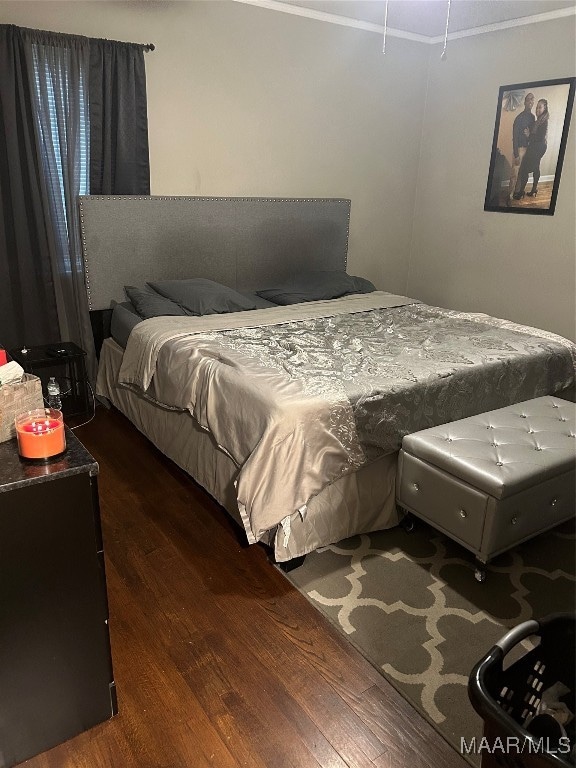 bedroom featuring dark hardwood / wood-style floors