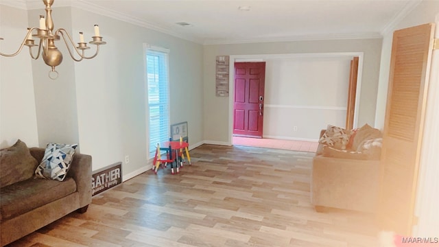 interior space with crown molding, a chandelier, and hardwood / wood-style flooring