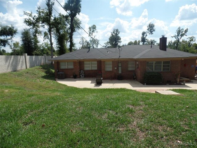 ranch-style house featuring a patio area and a front yard