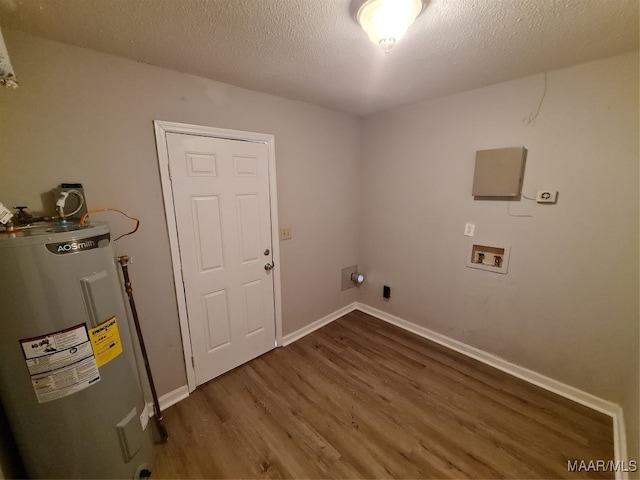 laundry area with washer hookup, a textured ceiling, electric water heater, dark hardwood / wood-style floors, and electric dryer hookup