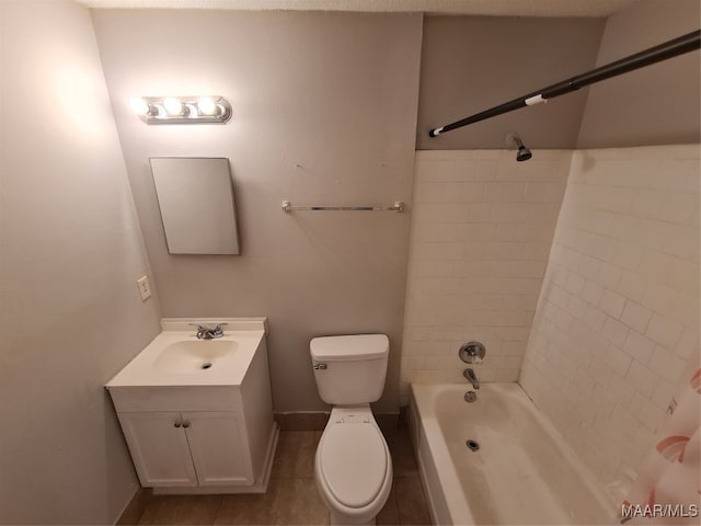 full bathroom featuring vanity, tiled shower / bath combo, toilet, and tile patterned floors