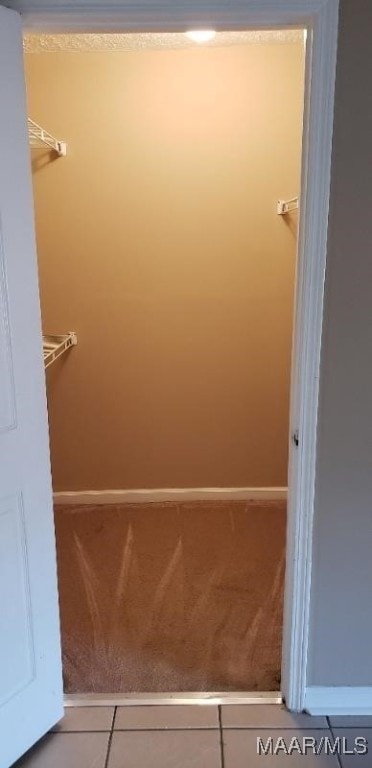 walk in closet featuring tile patterned floors