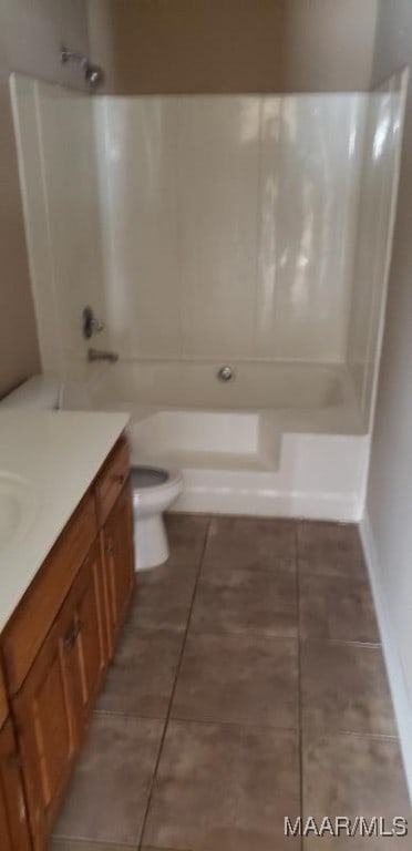 full bathroom with tile patterned flooring, shower / washtub combination, vanity, and toilet