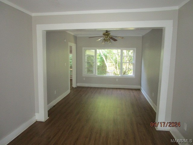 spare room with ceiling fan, dark hardwood / wood-style floors, and ornamental molding