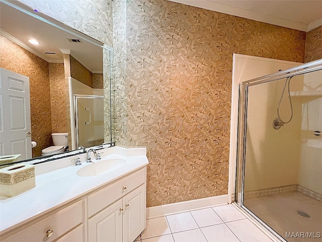 bathroom featuring vanity, tile patterned flooring, walk in shower, crown molding, and toilet