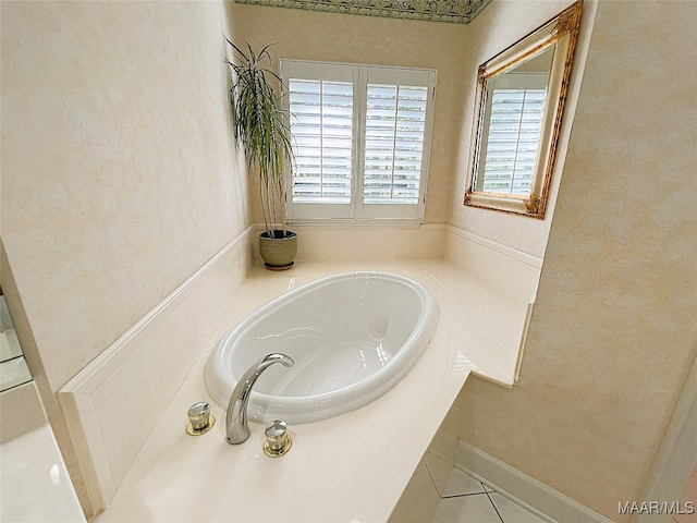 bathroom featuring tile patterned floors and a tub