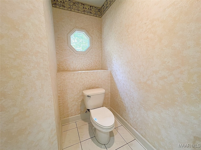 bathroom featuring tile patterned flooring and toilet