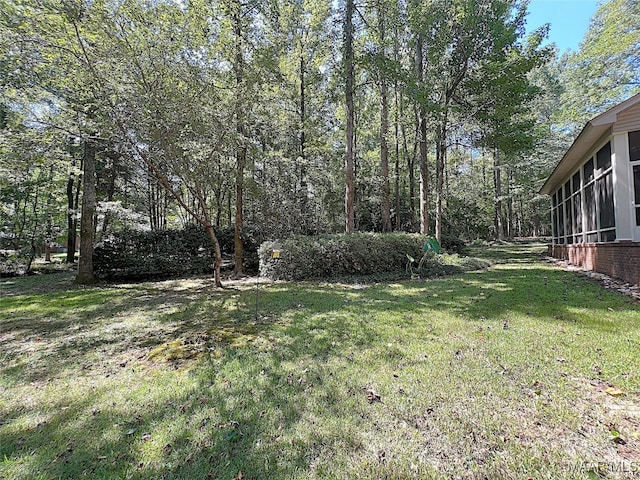 view of yard with a sunroom