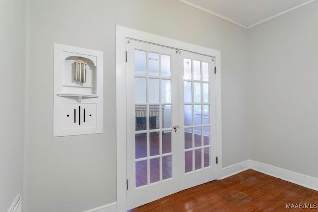 entryway with hardwood / wood-style flooring, french doors, and crown molding