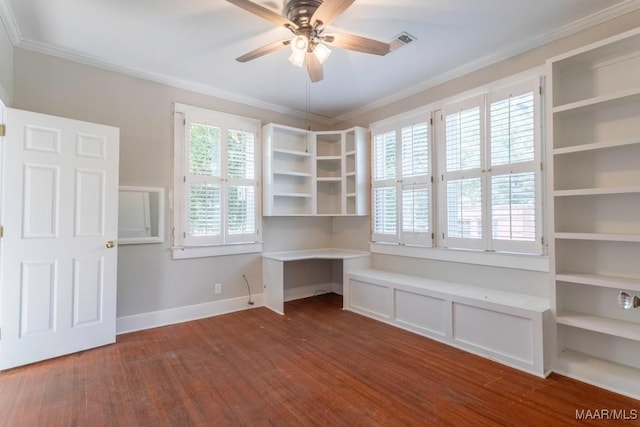 unfurnished office featuring ornamental molding, hardwood / wood-style floors, ceiling fan, and built in desk