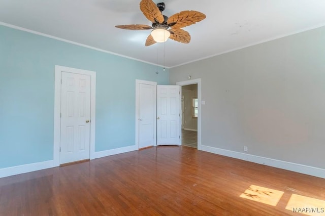 unfurnished bedroom featuring hardwood / wood-style flooring, ceiling fan, and ornamental molding