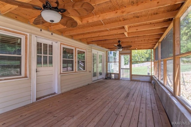 unfurnished sunroom featuring ceiling fan and wood ceiling