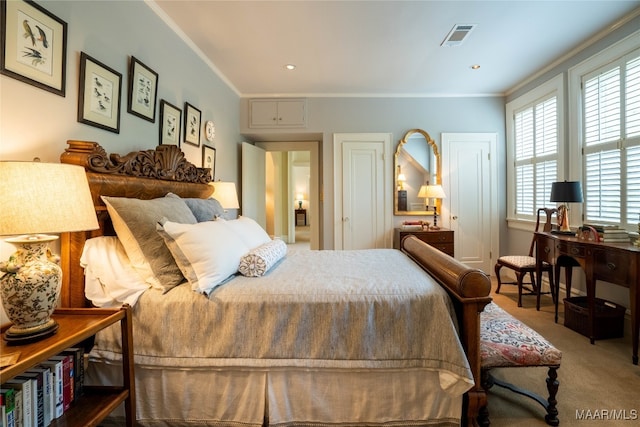 carpeted bedroom featuring crown molding