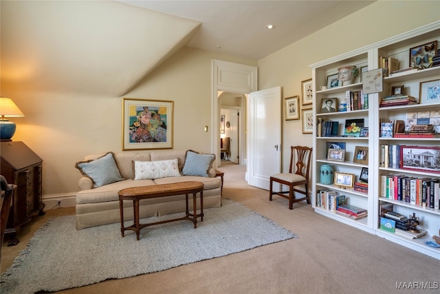 interior space featuring lofted ceiling and light colored carpet